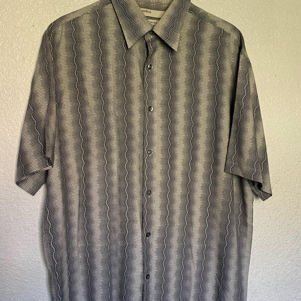 It’s large size,gray black and white color,half sleeve shirt.